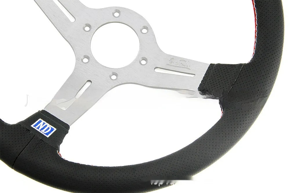 14-inch leather steering wheel with concave centre, shown with black and silver skeleton options