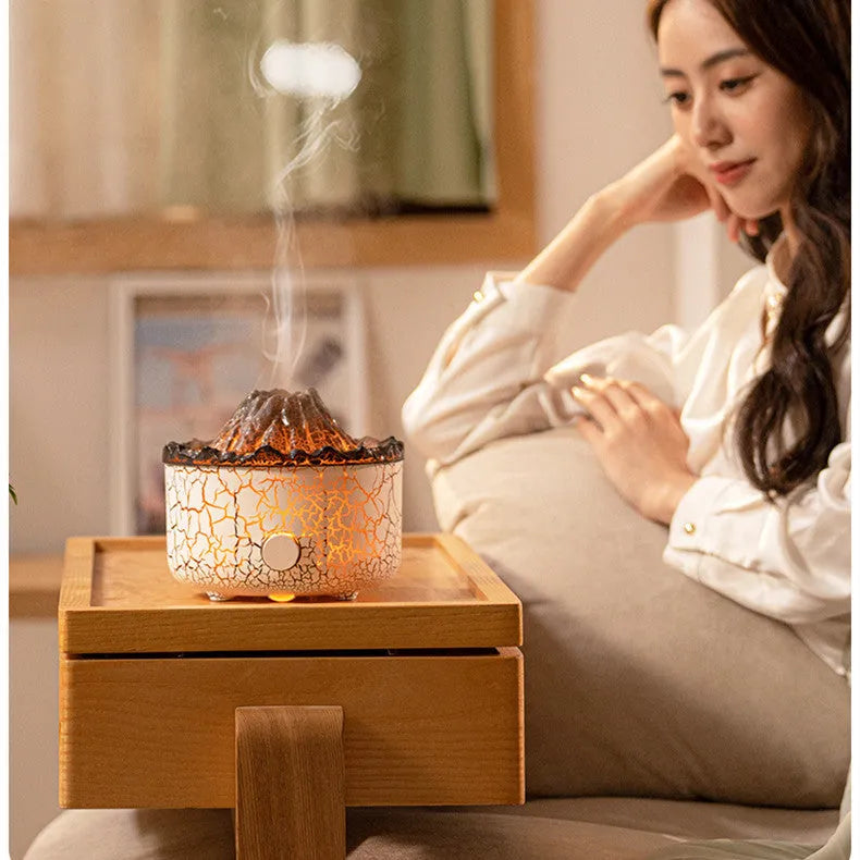 Creative column-shaped volcano humidifier diffuser with LED light flame effect and mist ring.