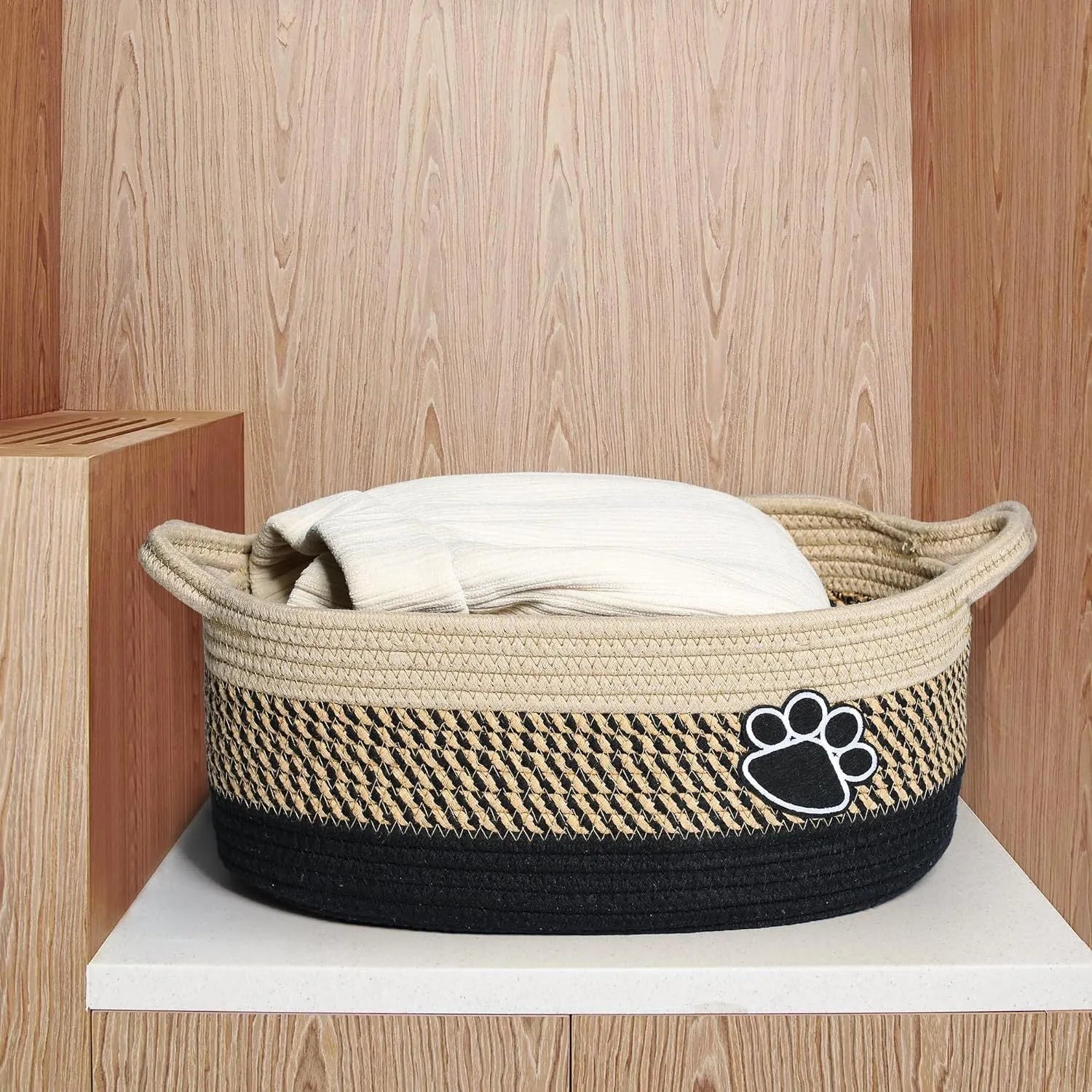 Handmade woven light beige cotton rope storage basket with wooden handles showing 34x26x15cm dimensions