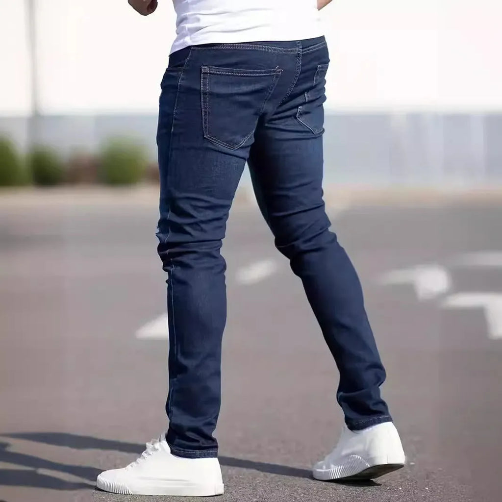 Men's dark blue skinny-fit casual jeans with a zip fly on a mid-waist.