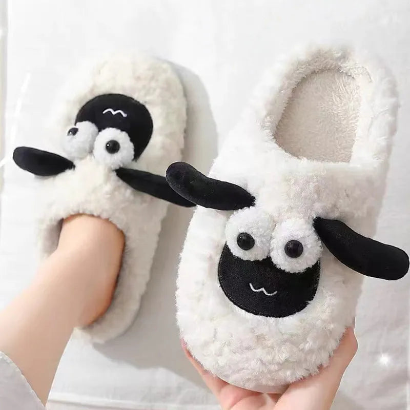 Brown slip-on slippers with suede upper and lamb thermal cotton lining on wooden floor