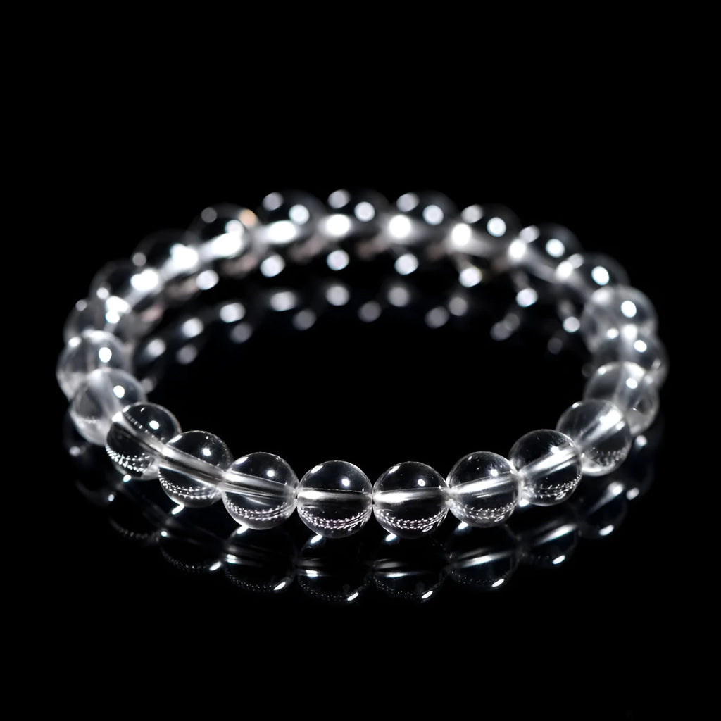 Natural white crystal bracelet with round beads, showing unisex geometry design on a wrist.