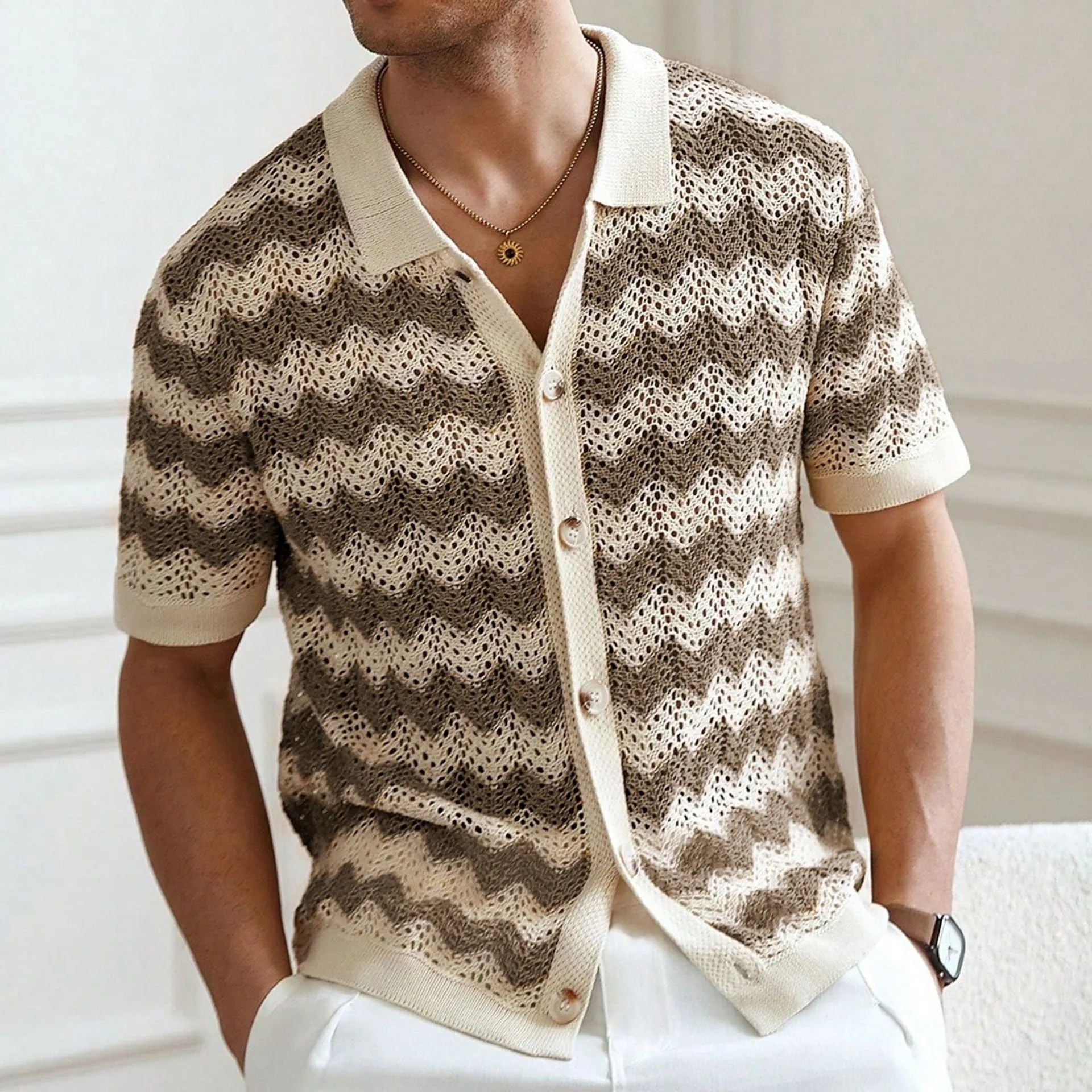 Short sleeve corrugated knit sweater in blue, brown, or yellow, showing textured jacquard pattern.