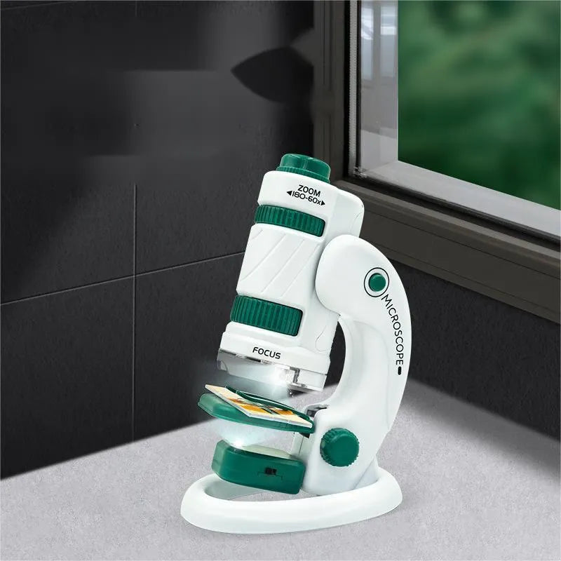 Portable plastic microscope with specimen slides in white-green colour scheme