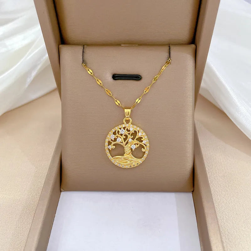 Gold-plated lucky tree pendant necklace with rhinestone zircons and mother of pearl on an adjustable chain.