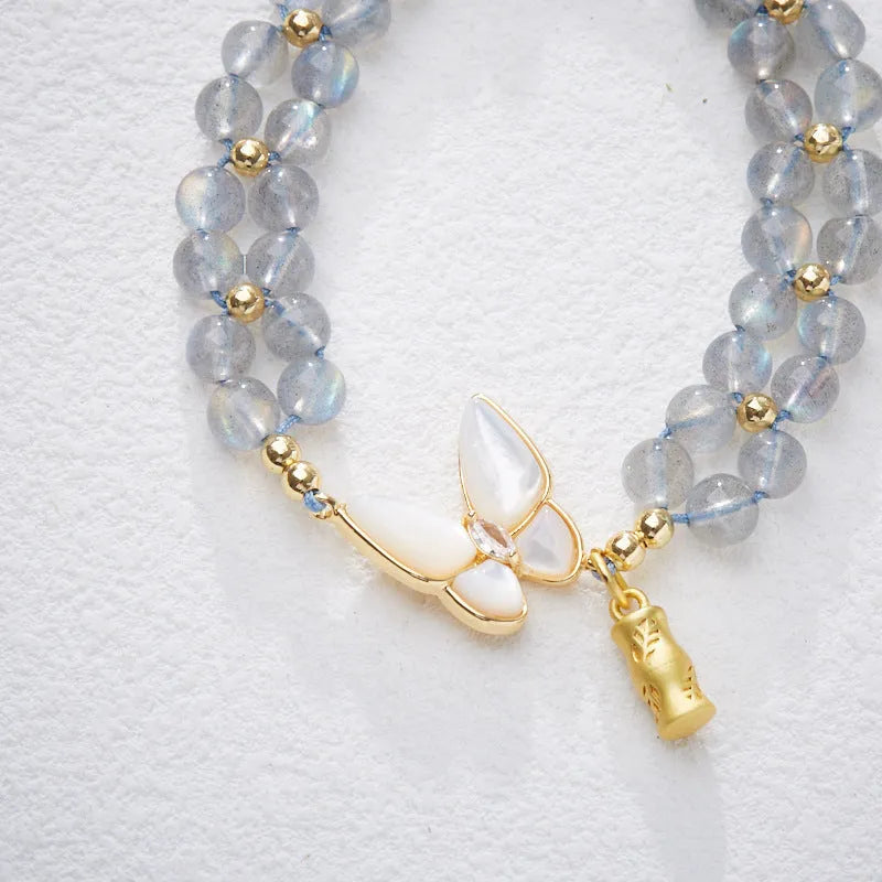 Gray moonstone bracelet with butterfly woven rope design and geometric retro styling