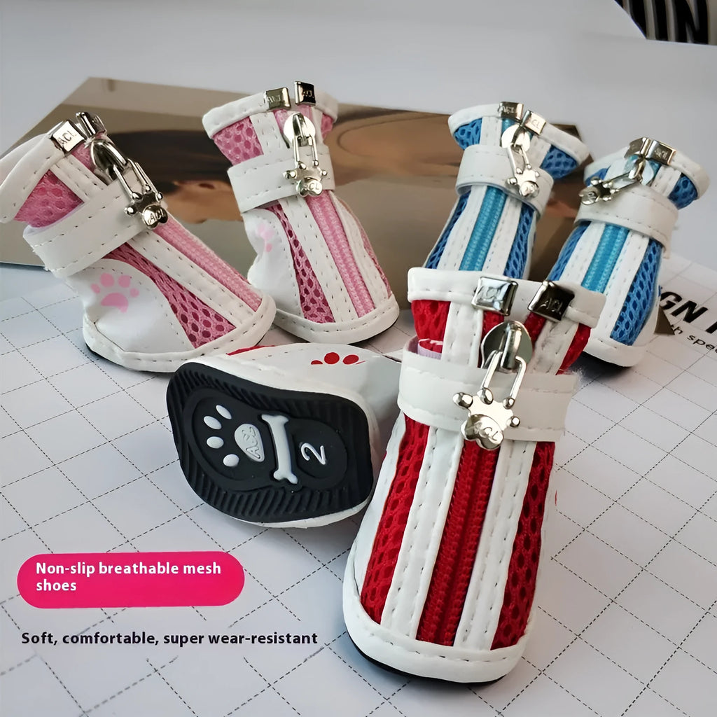 Set of four blue cloth dog shoes with zippers and non-slip soles for small to medium dogs.