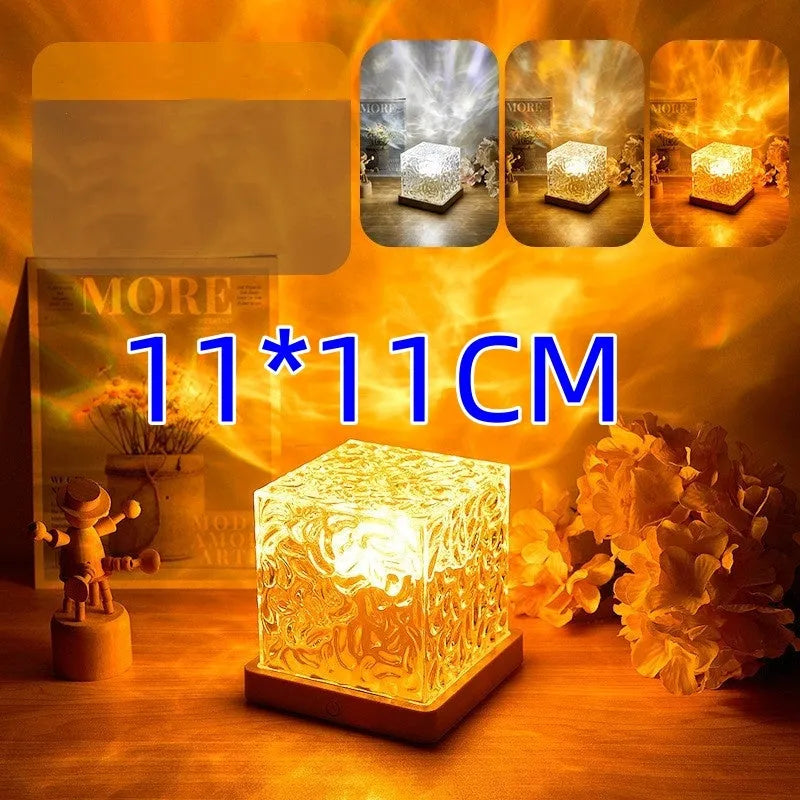 LED water ripple night light with rotating crystal projection and remote control on wooden surface