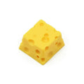 Yellow resin cheese design keycap for mechanical keyboards with Cherry MX switches.