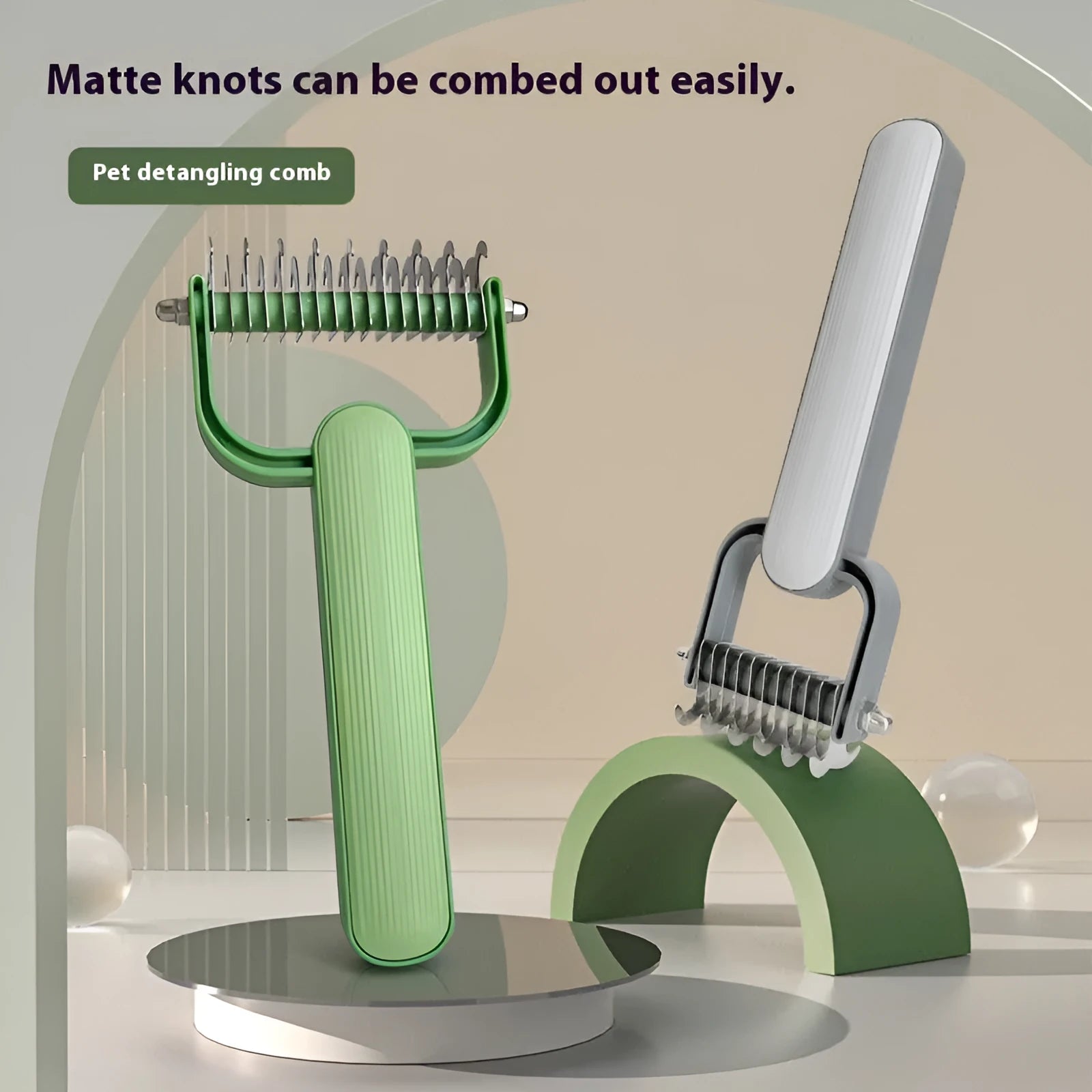Green and grey dog unknotting combs showing large and small sizes with stainless steel pins.