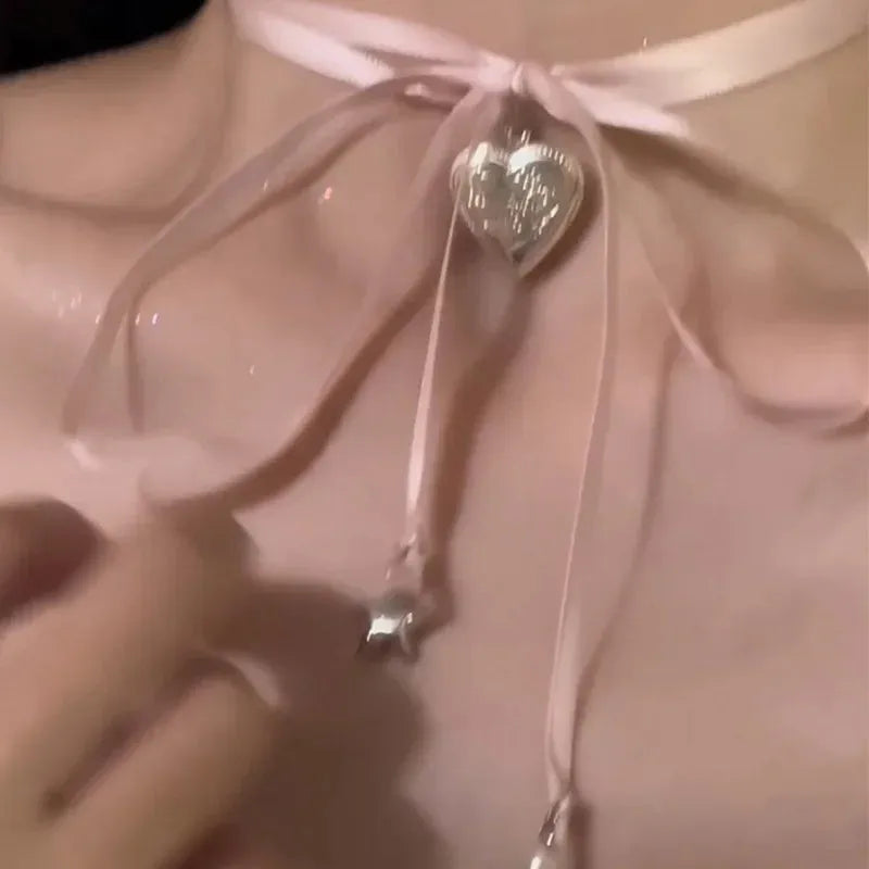 Women's ribbon love pendant necklace on clavicle chain in alloy with electroplated finish