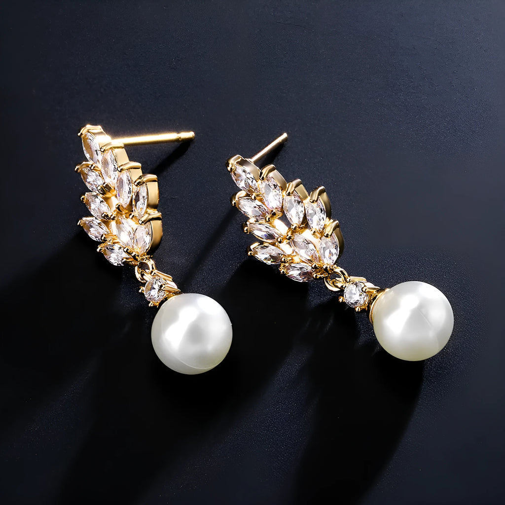 Geometric flower shape stud earrings with micro inlaid zircon stones in gold, rose gold, or white gold plating.