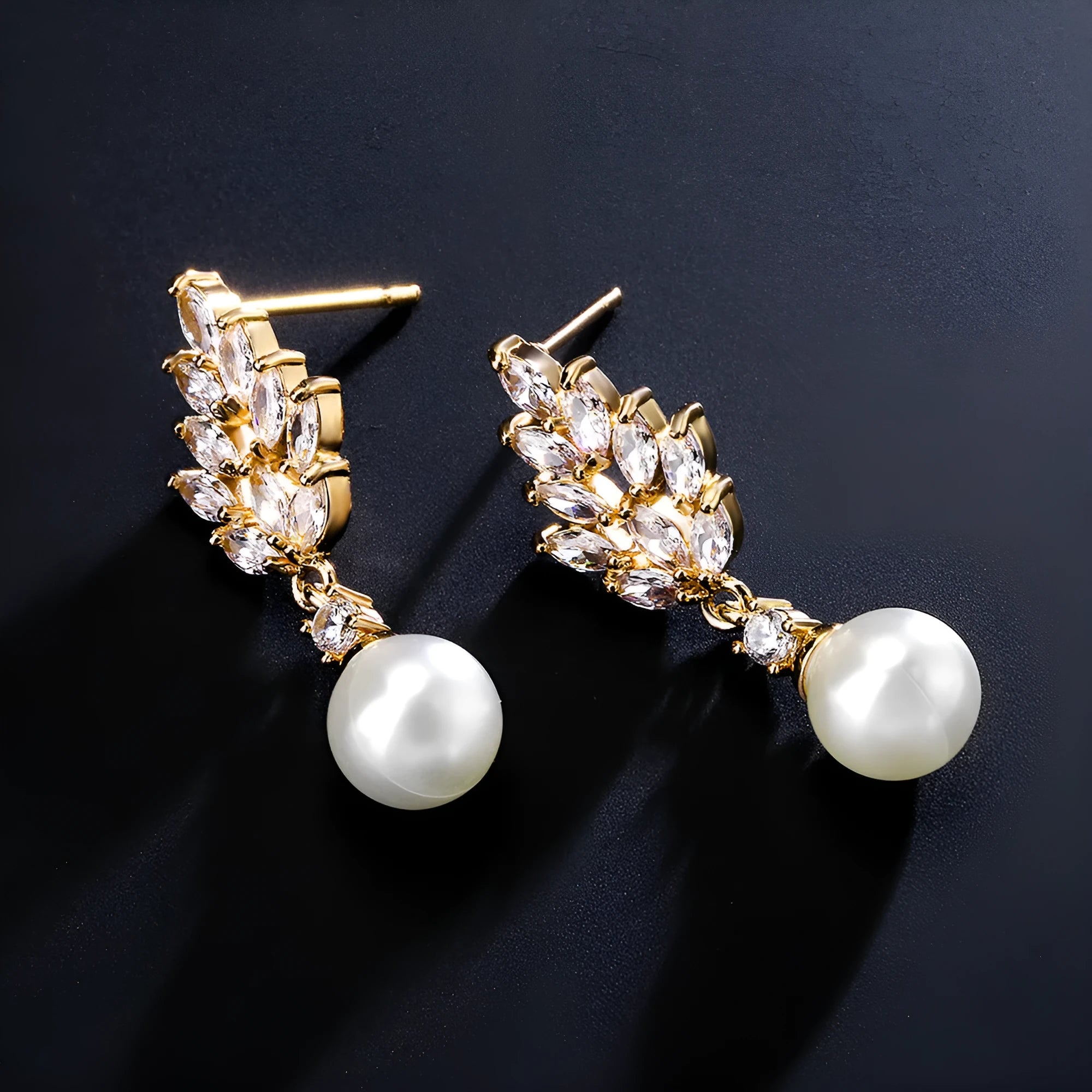 Geometric flower shape stud earrings with micro inlaid zircon stones in gold, rose gold, or white gold plating.