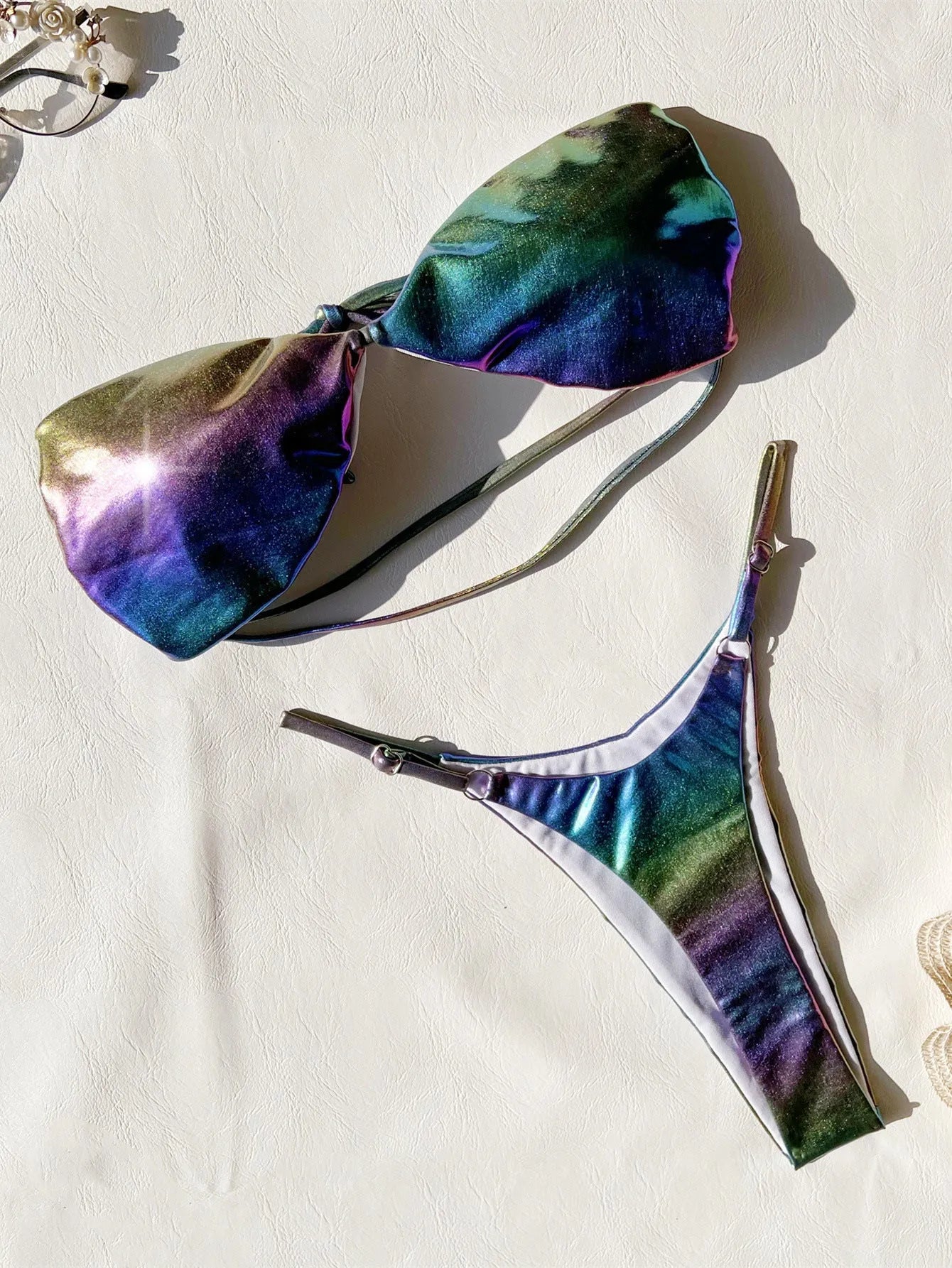 Women's purple gradient bikini swimsuit set made of polyester fabric.
