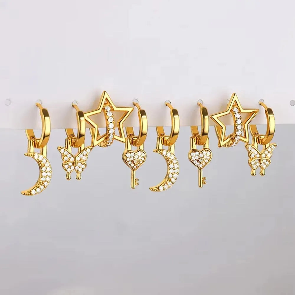 Women's copper geometric butterfly earrings with heart and star motifs in various colours.