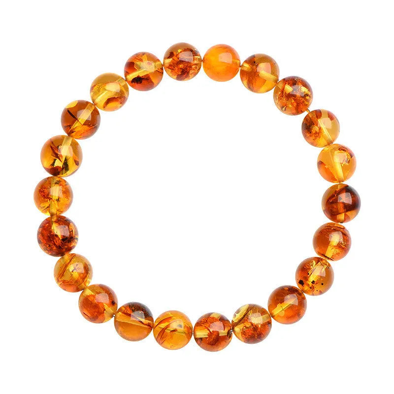 Natural yellow piebald amber geometric bracelet on a white background.