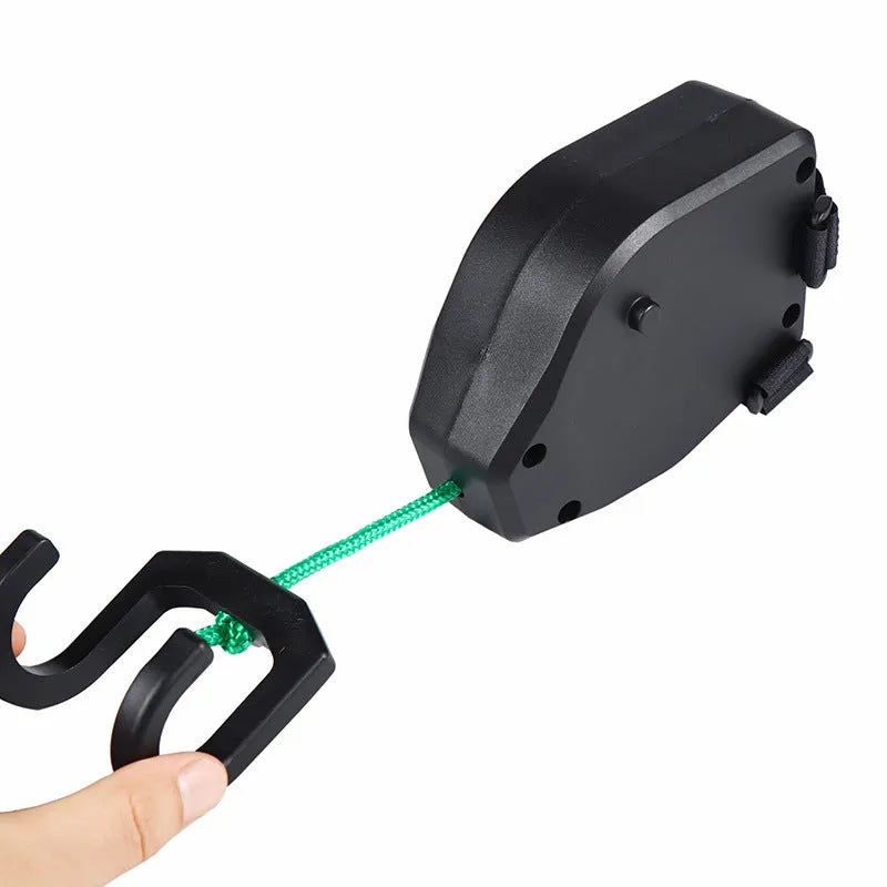 Black plastic and resin bicycle trailer connector rope for towing a child's trailer.