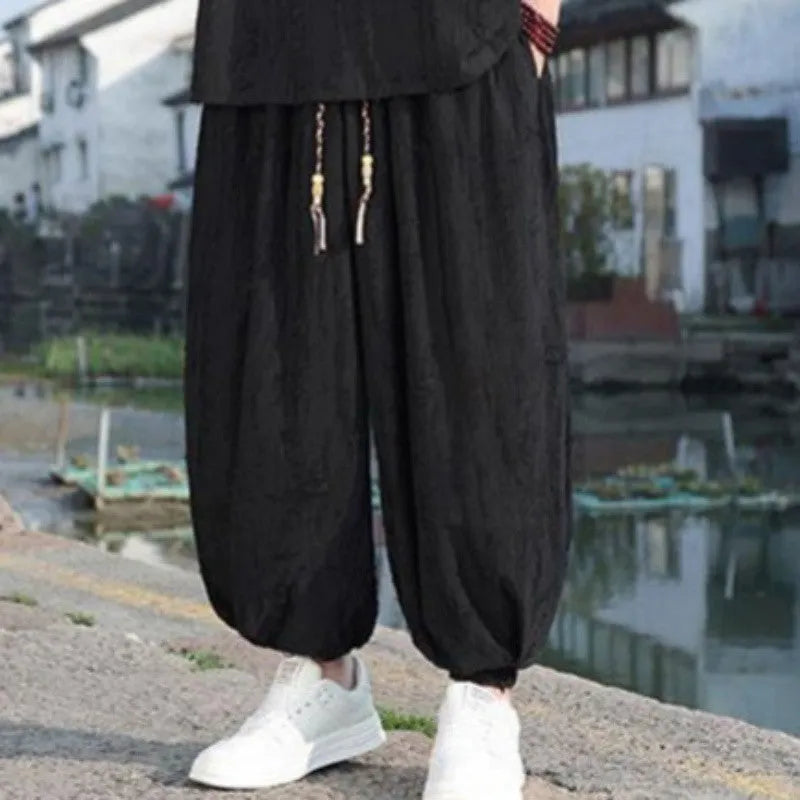 Men's loose two-piece summer suit set with thin short-sleeved top and cropped trousers in black or grey