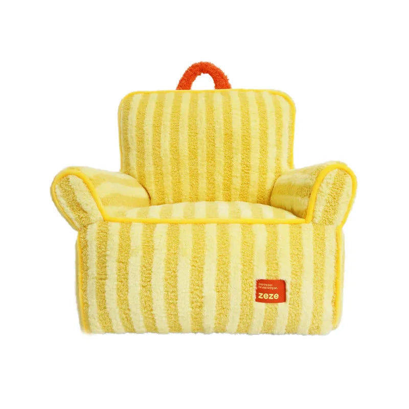 Striped orange plush dog bed with a removable cover on a wooden floor.