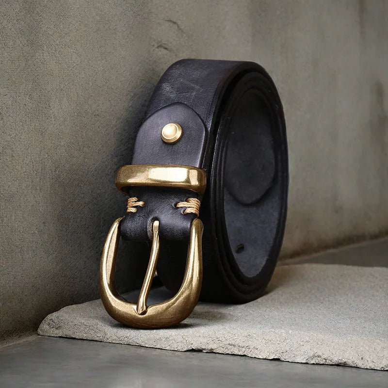 Men's brown casual leather belt with a copper pin buckle on a textured background.
