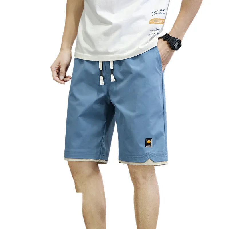 Men's loose-fit casual shorts in polyester fabric, shown in a solid colour with a straight Korean-style cut.