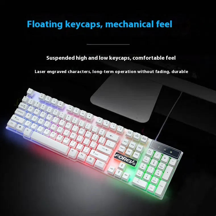 FV-Q1 wired luminous keyboard with six-colour backlight on a desk, connected to a computer