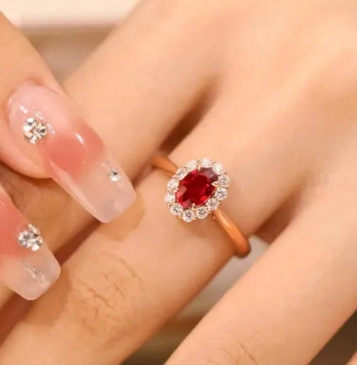 Gold pigeon blood ruby sterling silver ring with floral design and artificial gemstone centre