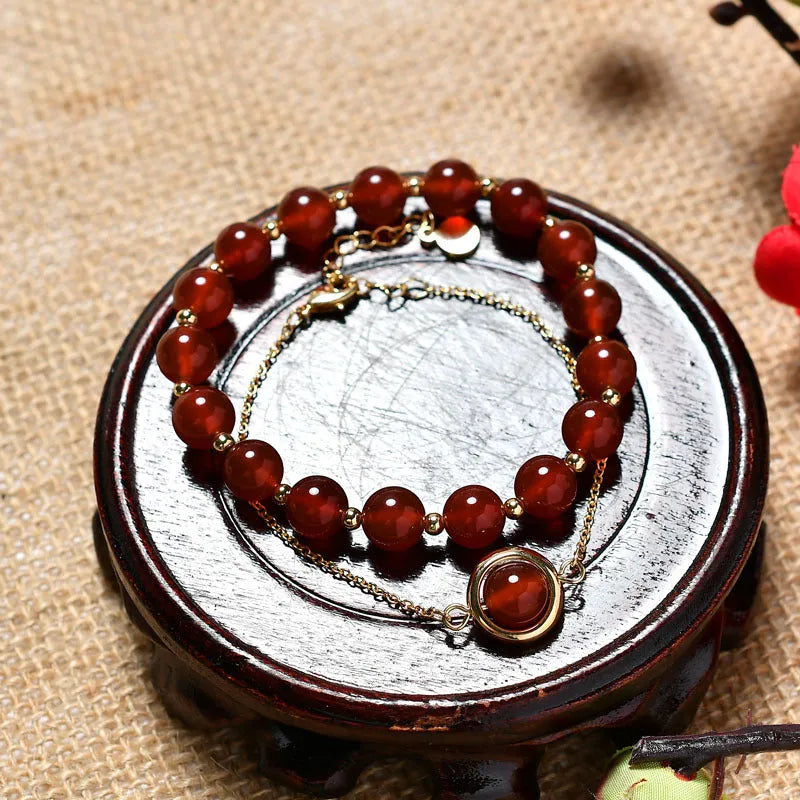 Double-layer women's bracelet with crystal beads and lucky charms in gold electroplated finish