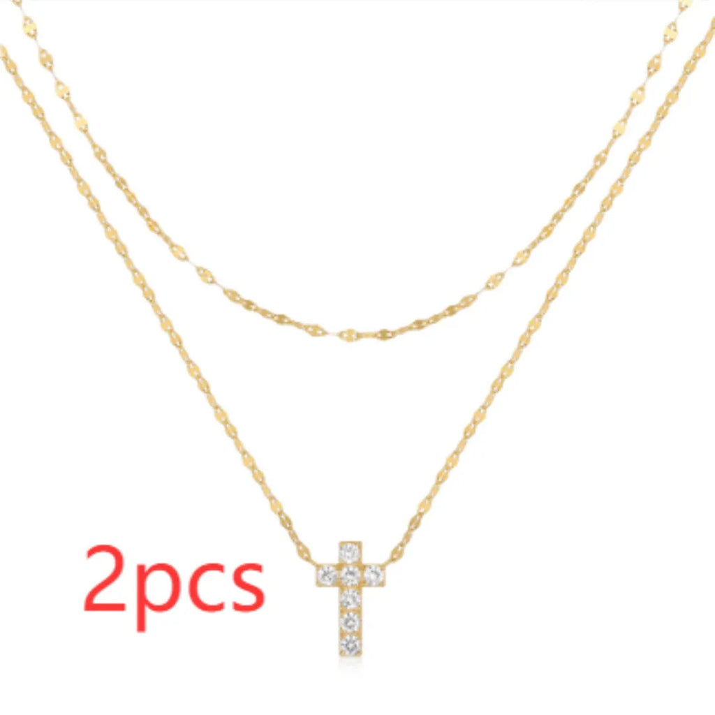S925 sterling silver double layer geometric cross pendant necklace with twin diamond detail on a clavicle chain.