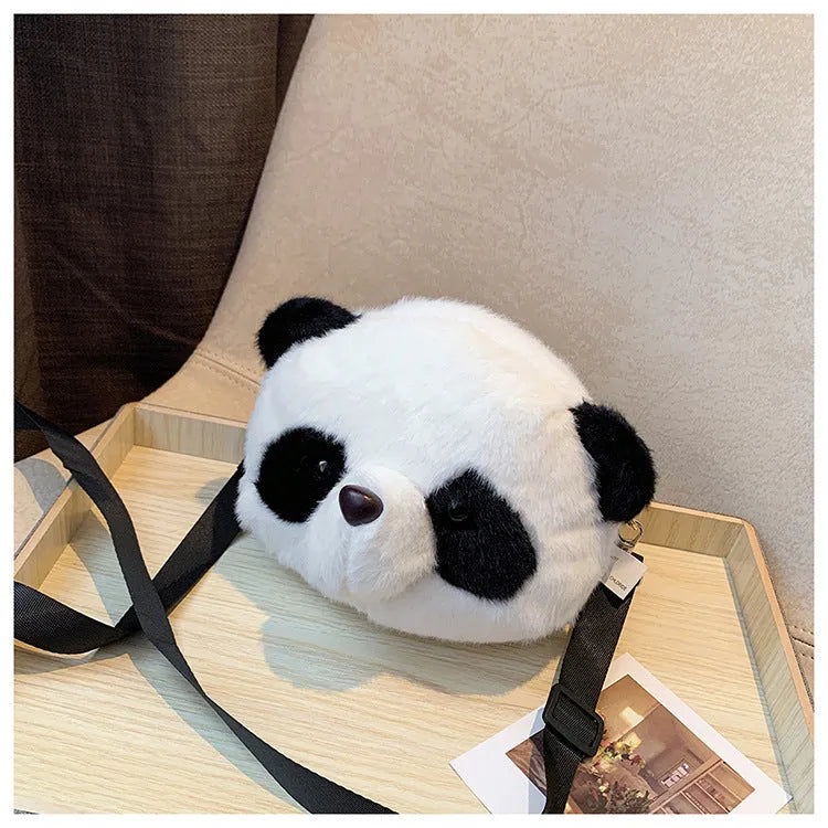 Soft plush crossbody bag with panda head design, shown in cylindrical shape.