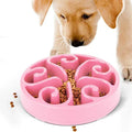 A slow feeder dog bowl with a maze pattern inside, shown in one of six available colours on a non-slip base.