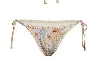 Women's creamy-white floral pattern bikini suit with matching skirt