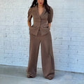 Brown men's slim fit polyester suit jacket and trousers on a hanger