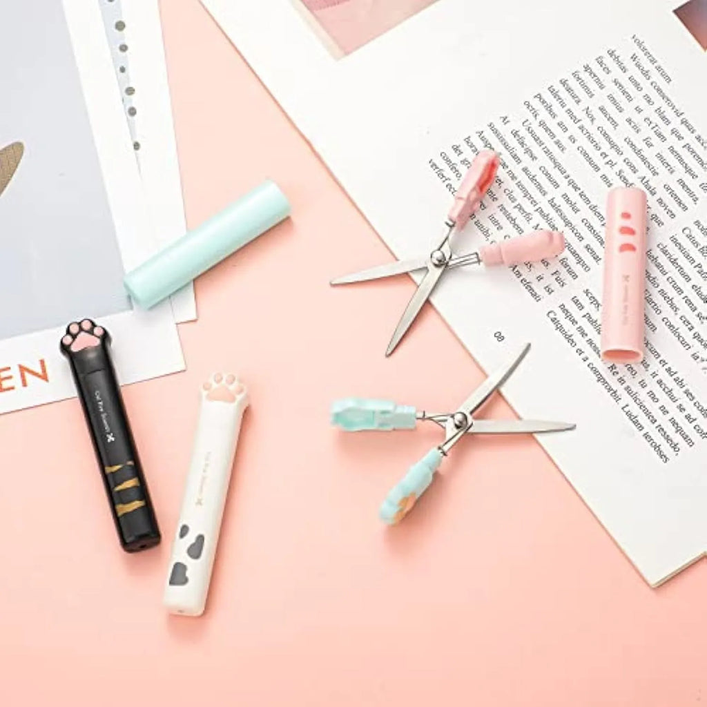 Cat paw mini folding scissors in pink, white, black and blue colours showing compact 8.7 cm size