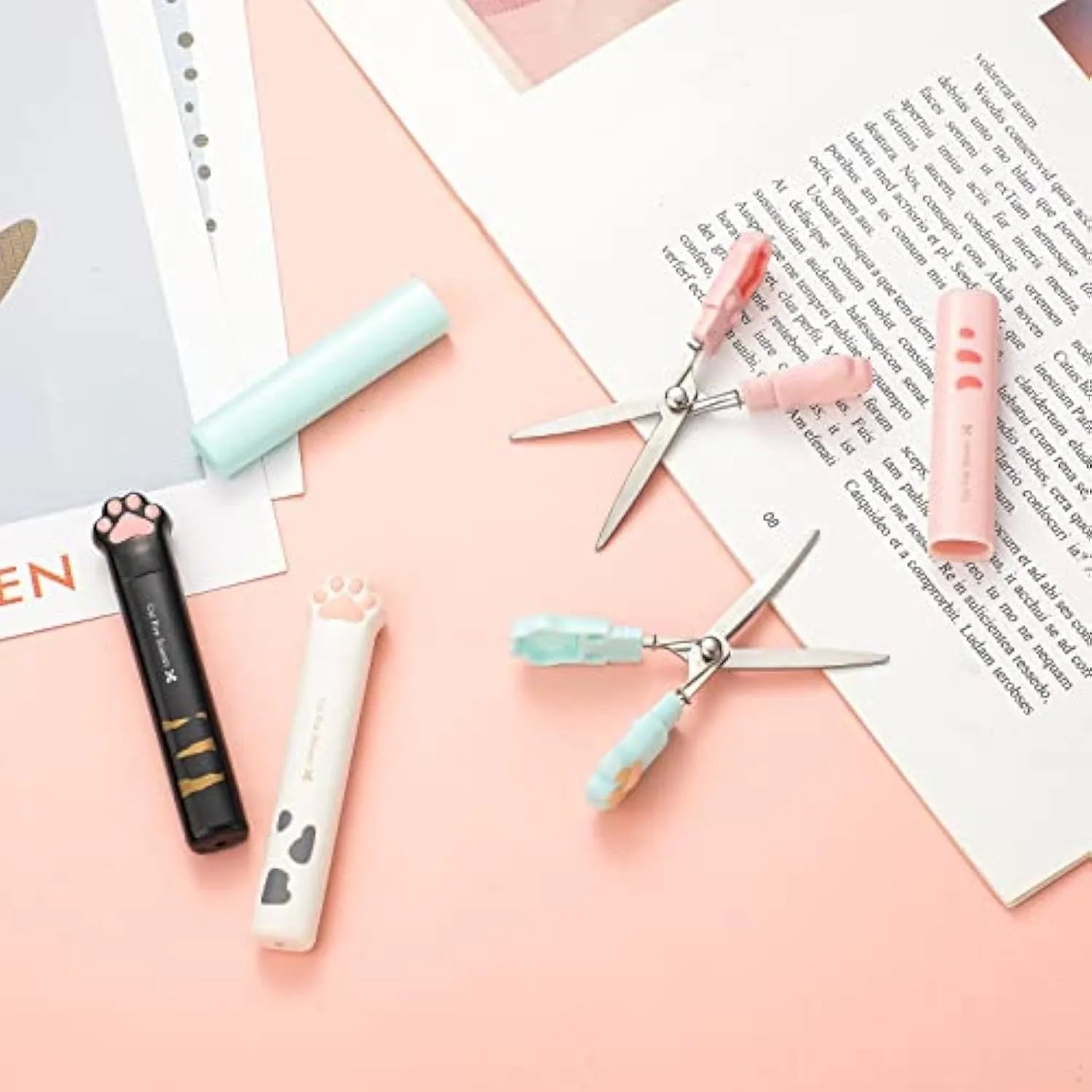 Cat paw mini folding scissors in pink, white, black and blue colours showing compact 8.7 cm size