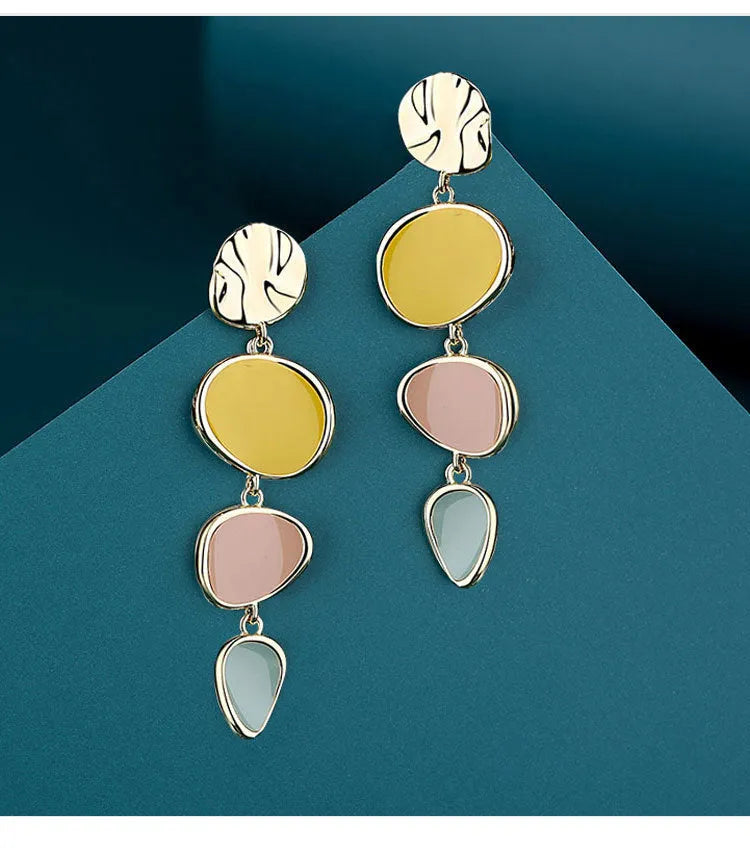 Morandi three-colour dripping oil finish alloy disc earrings on a sterling silver post.