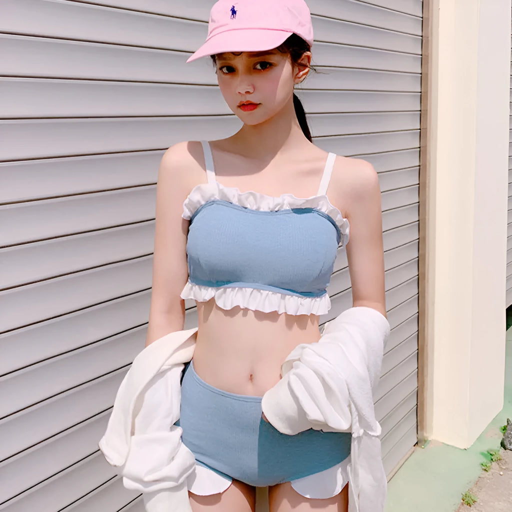 Women's conservative one-piece swimsuit with suspender straps in solid colour