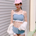 Women's conservative one-piece swimsuit with suspender straps in solid colour