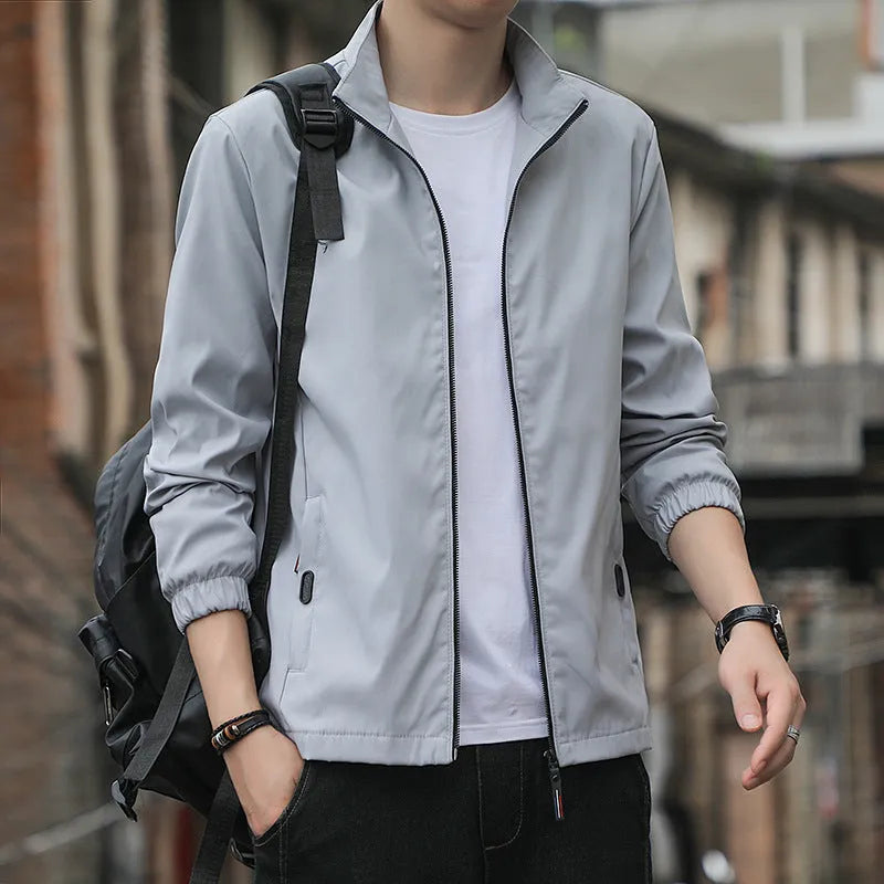 Men's Korean style loose lapel casual jacket in blue with zipper pockets.