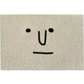 Square PVC home floor mat with a geometric pattern and cartoon Mr. Big Nose facial expression.