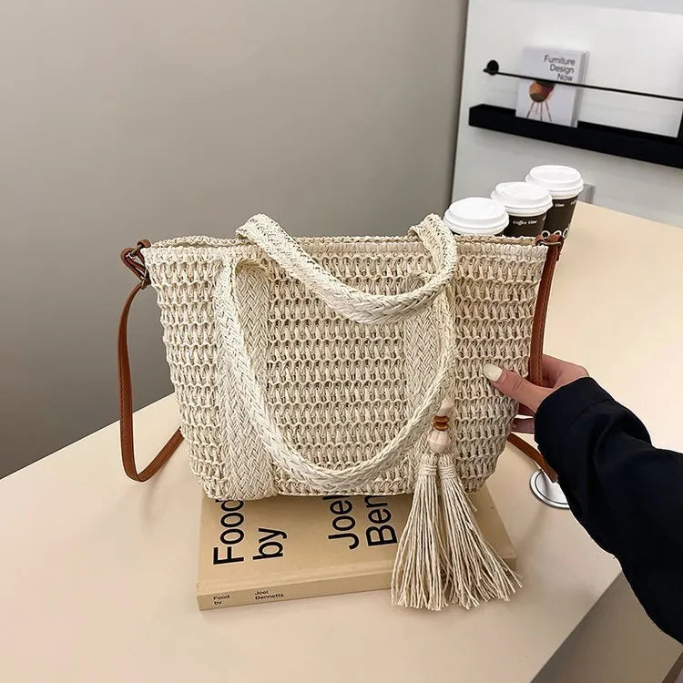 Women's straw crossbody shoulder bag with woven texture in milky white colour showing large capacity interior