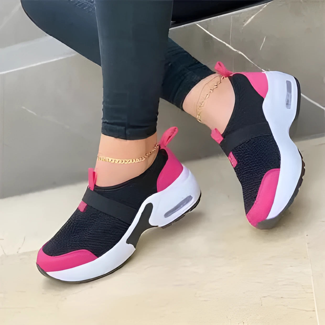 Women's white mesh flat sneakers with a round toe and non-slip rubber sole.