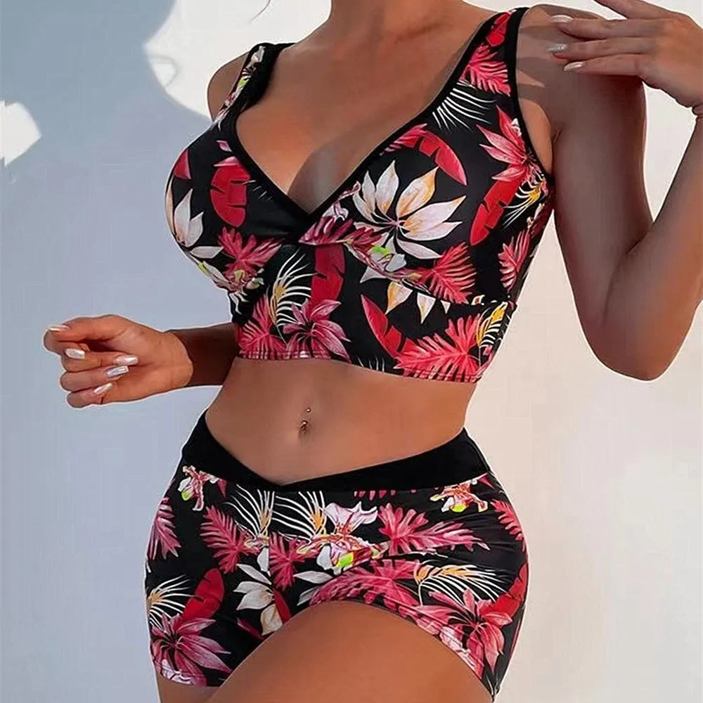 Women's two-piece swimsuit set showing sleeveless top and matching printed boxer shorts in a floral pattern.