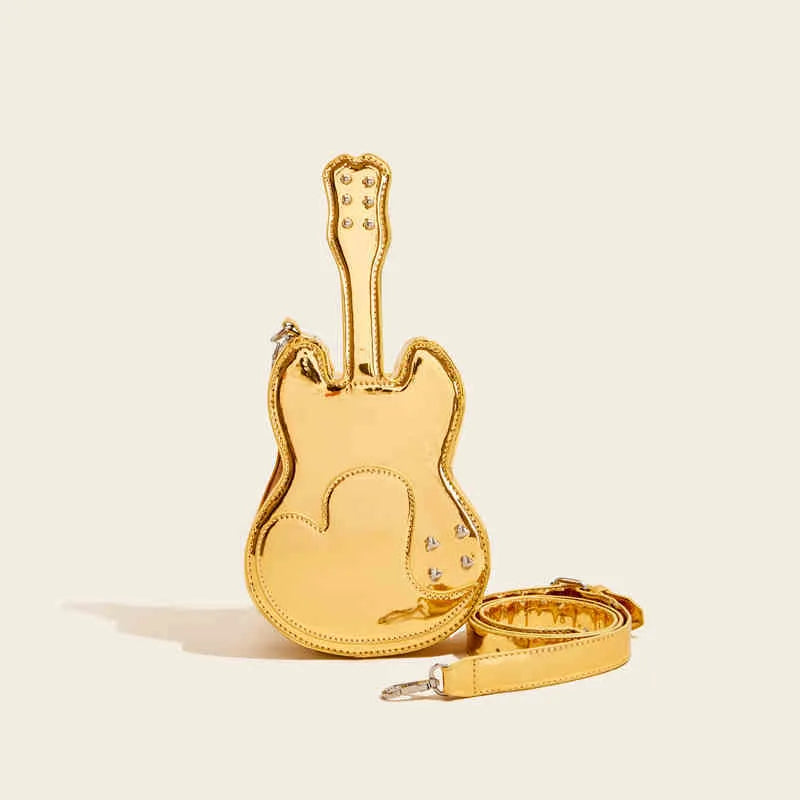Guitar-shaped silver crossbody shoulder bag with a black strap.