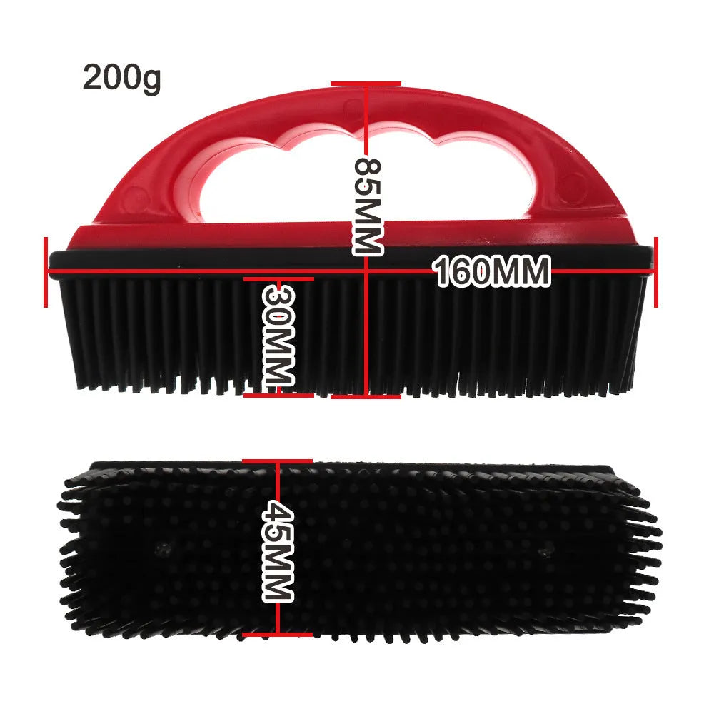 Red silicone pet hair removal brush with oval head measuring 160mm by 85mm.