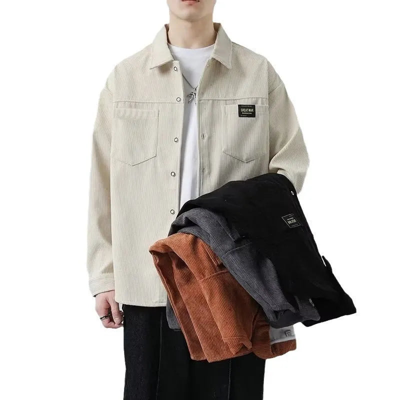 Men's black corduroy cardigan jacket with long sleeves on a hanger.