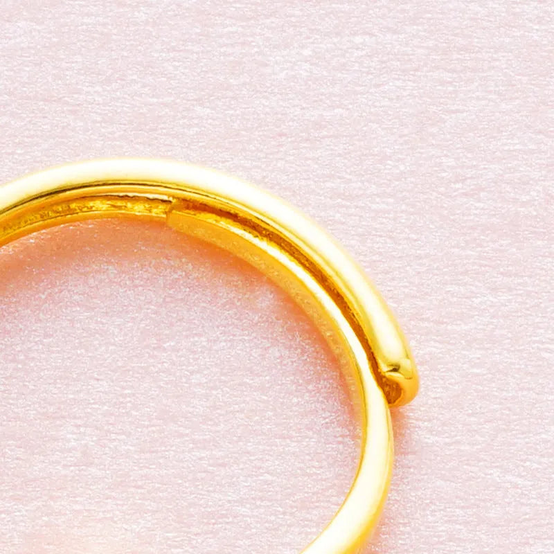 Women's adjustable copper ring with placer gold zircon stone, shown in multiple colour options.