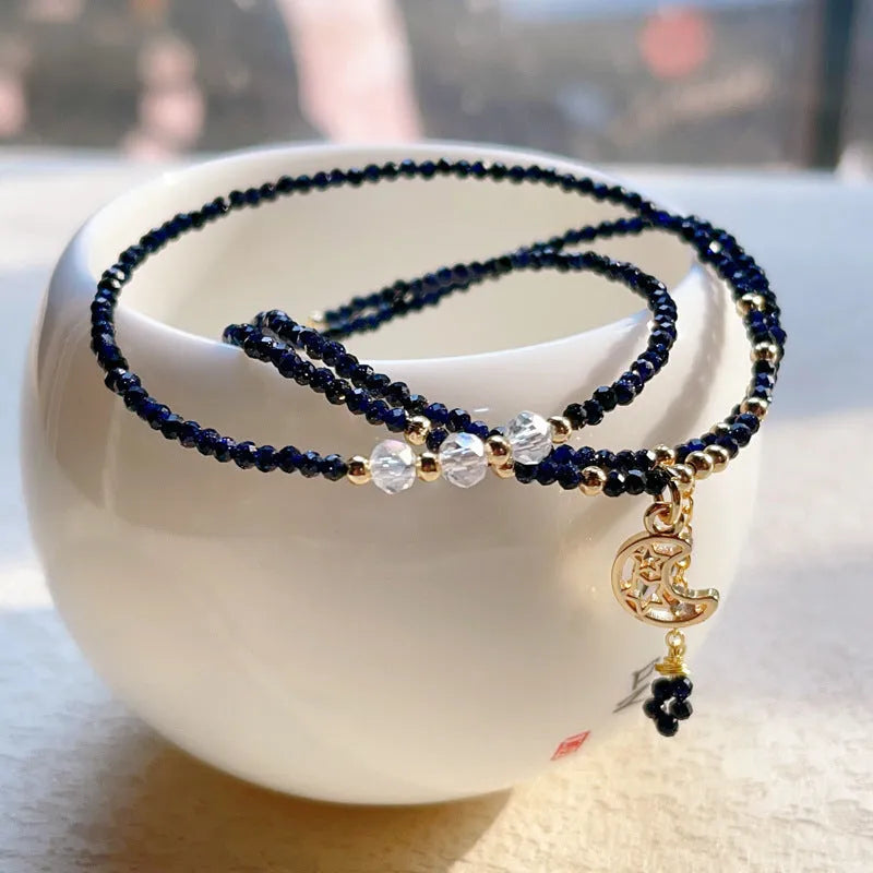 Blue gold three-ring women's bracelet with blue sand stone gemstone on adjustable fastening