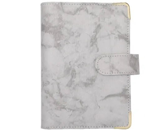 A6 loose-leaf binder journal with marbling leather PU cover, open to show budget sheets and zip pockets