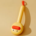 Small yellow duck-shaped pet grooming comb with open sections for cats and dogs